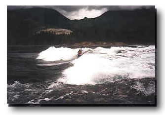 Kayaker surfing 